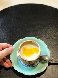 Close-up of hand holding bowl