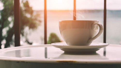 Close-up of coffee cup on table