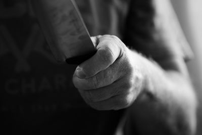 Cropped image of holding knife