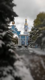 Low angle view of church against cloudy sky