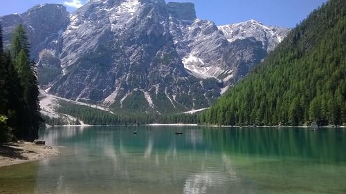 Scenic view of lake and mountains against sky