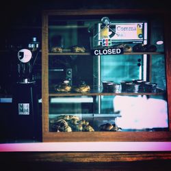 Text on glass window at restaurant