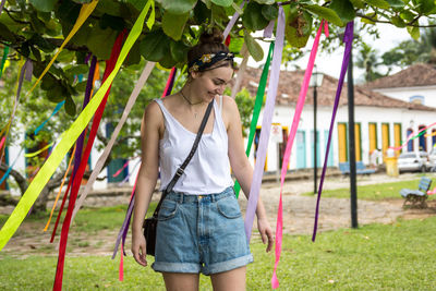 Woman standing on swing at playground