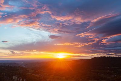 Scenic view of landscape against sky during sunset