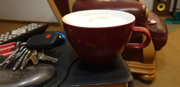 Close-up of coffee cup on table