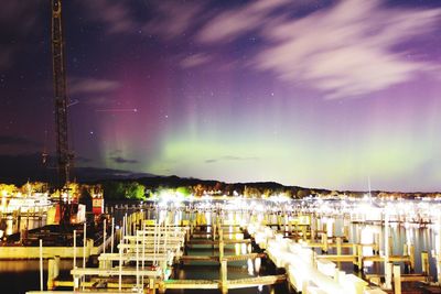 Panoramic view of illuminated buildings against sky at night