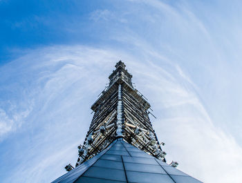 Low angle view of building against cloudy sky