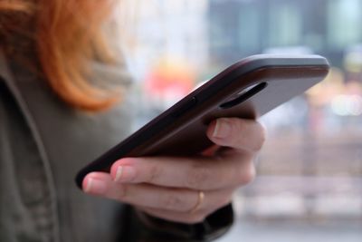 Close-up of woman using mobile phone