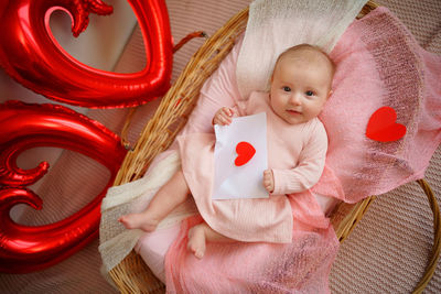 Valentine's day, little girl with valentine envelope