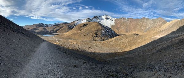 Panoramic view of snowcapped mountains against sky