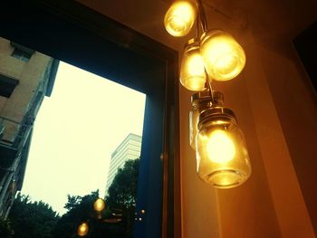 Low angle view of illuminated street light at night