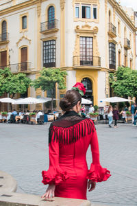 Woman sitting on city street
