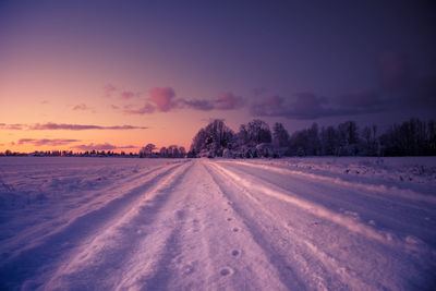 A beautiful winter morning landscape with a gravel road. bright, extra colorful scenery.