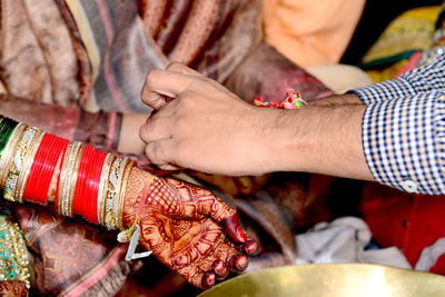 Low section of woman with hands