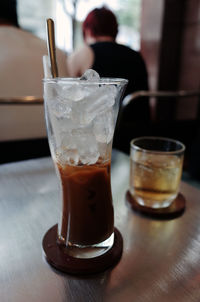 Close-up of beer glass on table