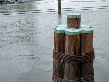 Close-up of wooden post in sea