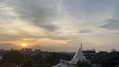 Panoramic view of buildings against sky during sunset