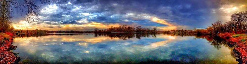 Scenic view of lake against cloudy sky