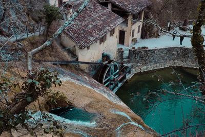 High angle view of abandoned house by building