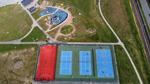 High angle view of tennis courts and a basketball court 