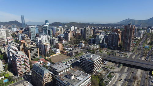 High angle view of modern buildings against clear sky