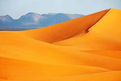 Scenic view of desert against clear sky