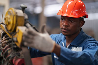 Portrait of man working in factory