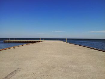 Pier over sea against sky