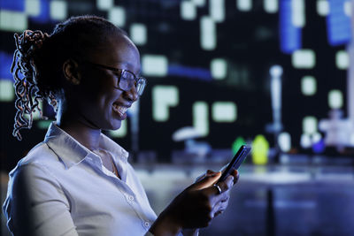 Young woman using mobile phone