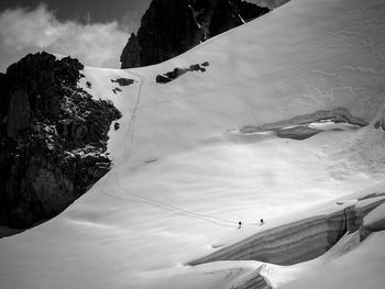 High angle view of people skiing on snowcapped mountain