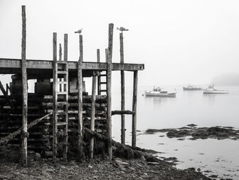 View of industrial building with sea in background