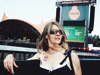 Portrait of young woman in sunglasses