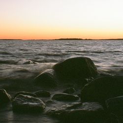 Scenic view of sea at sunset