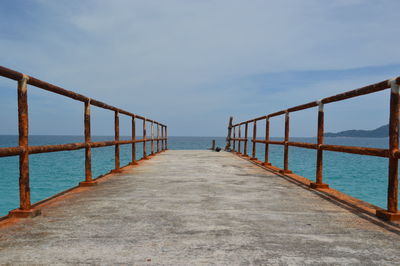 Pier over sea against sky