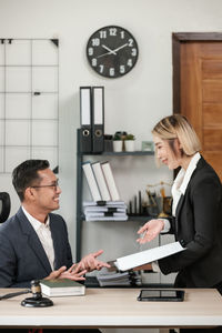 Business colleagues working in office