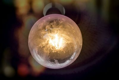 Close-up of illuminated light bulb