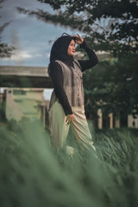 Woman standing on field