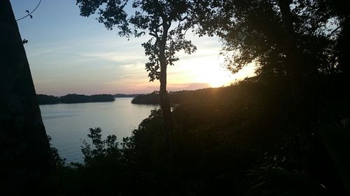 Scenic view of lake at sunset