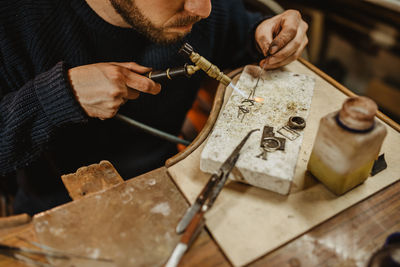 Man working on barbecue grill