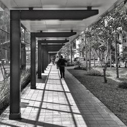 Woman walking on footbridge