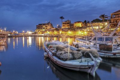 Boats moored at harbor