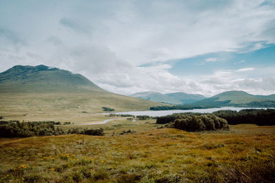 Scenic view of landscape and mountains against sky