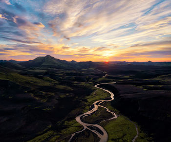 Scenic view of landscape against sky during sunset