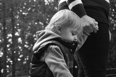 Side view of baby girl in park