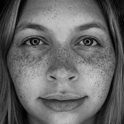 Close-up portrait of a smiling young woman