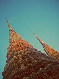 Low angle view of tree against blue sky