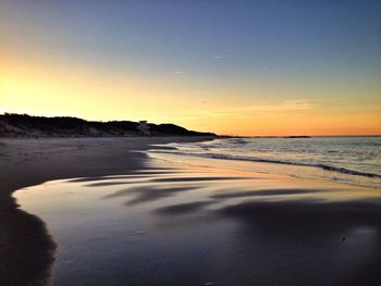 Scenic view of sea at sunset