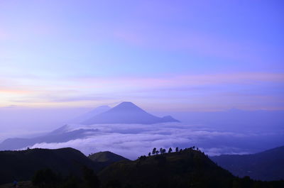 Scenic view of mountains against sky during sunset