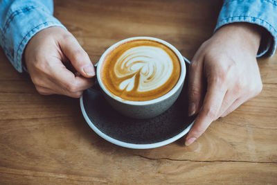 High angle view of coffee cup on table