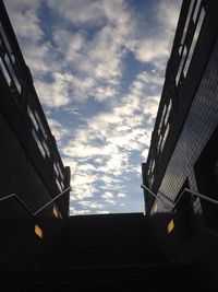 Low angle view of building against cloudy sky